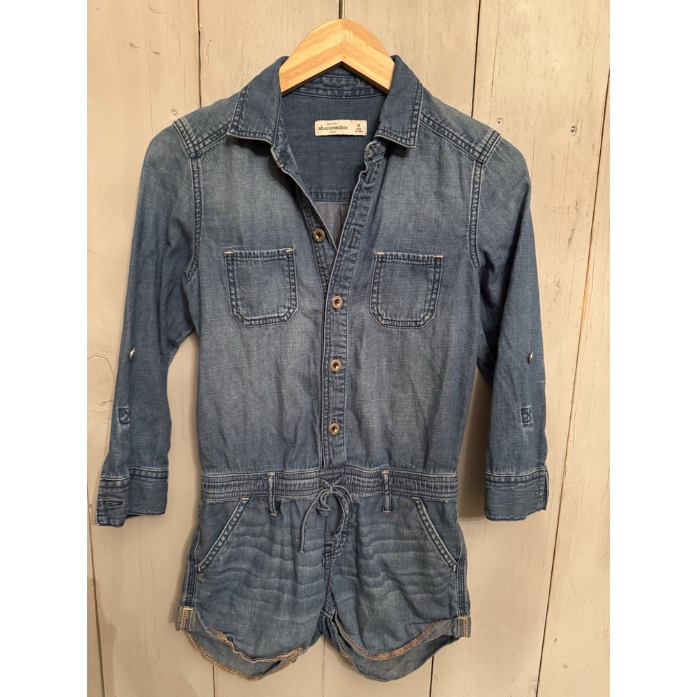 Abercrombie Kids denim romper features a drawstring waist and button-up front M‎